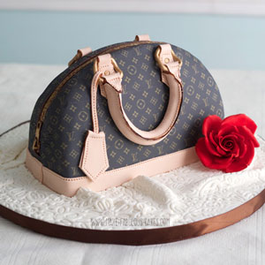 This Is My First Louis Vuitton Bag Cake I Used A Stencil To Make The Logo I  Did It With A Sponge Dipped In Gold Edible Paint The Bag Is 