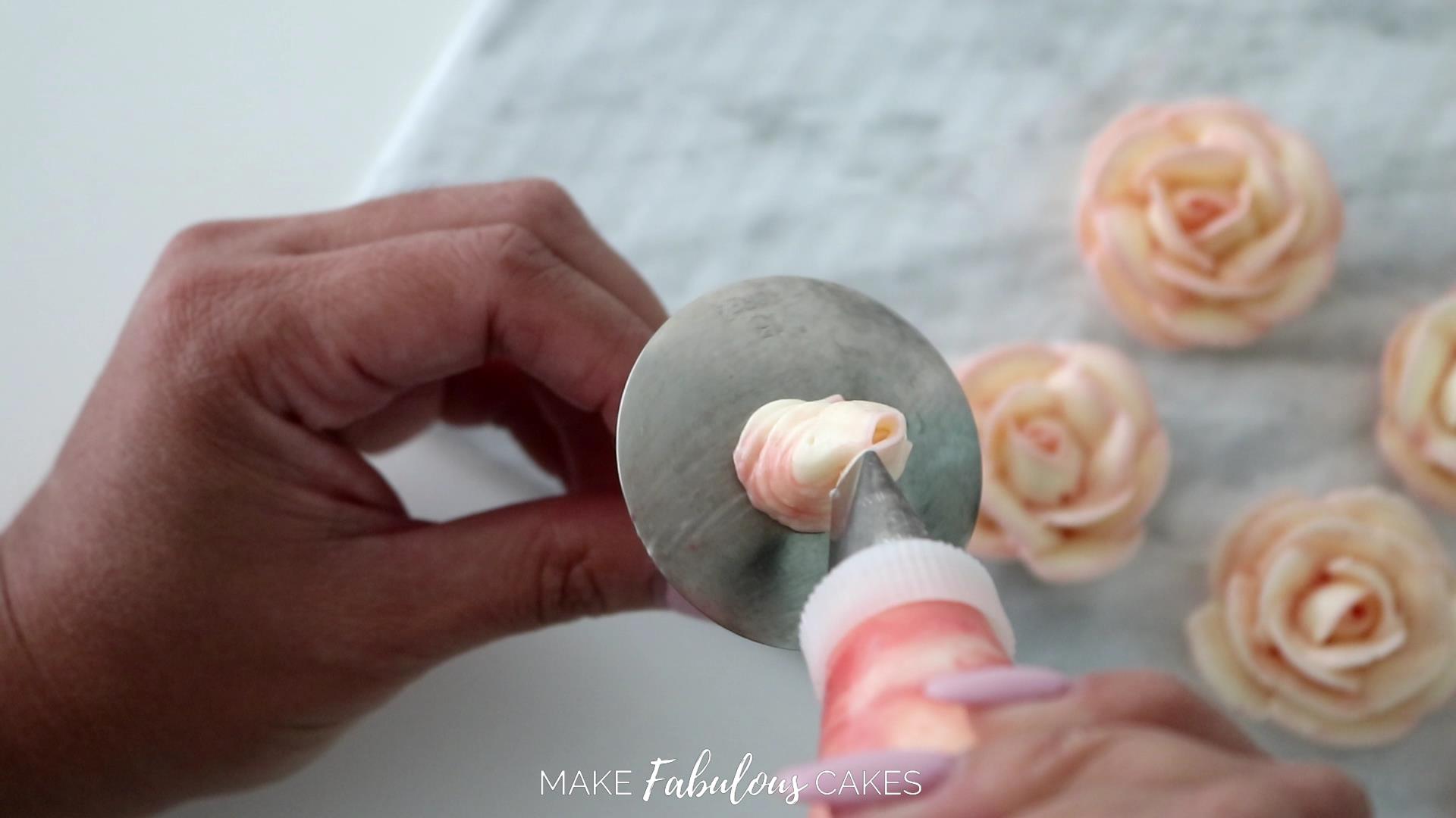 swan cake piping a buttercream rose