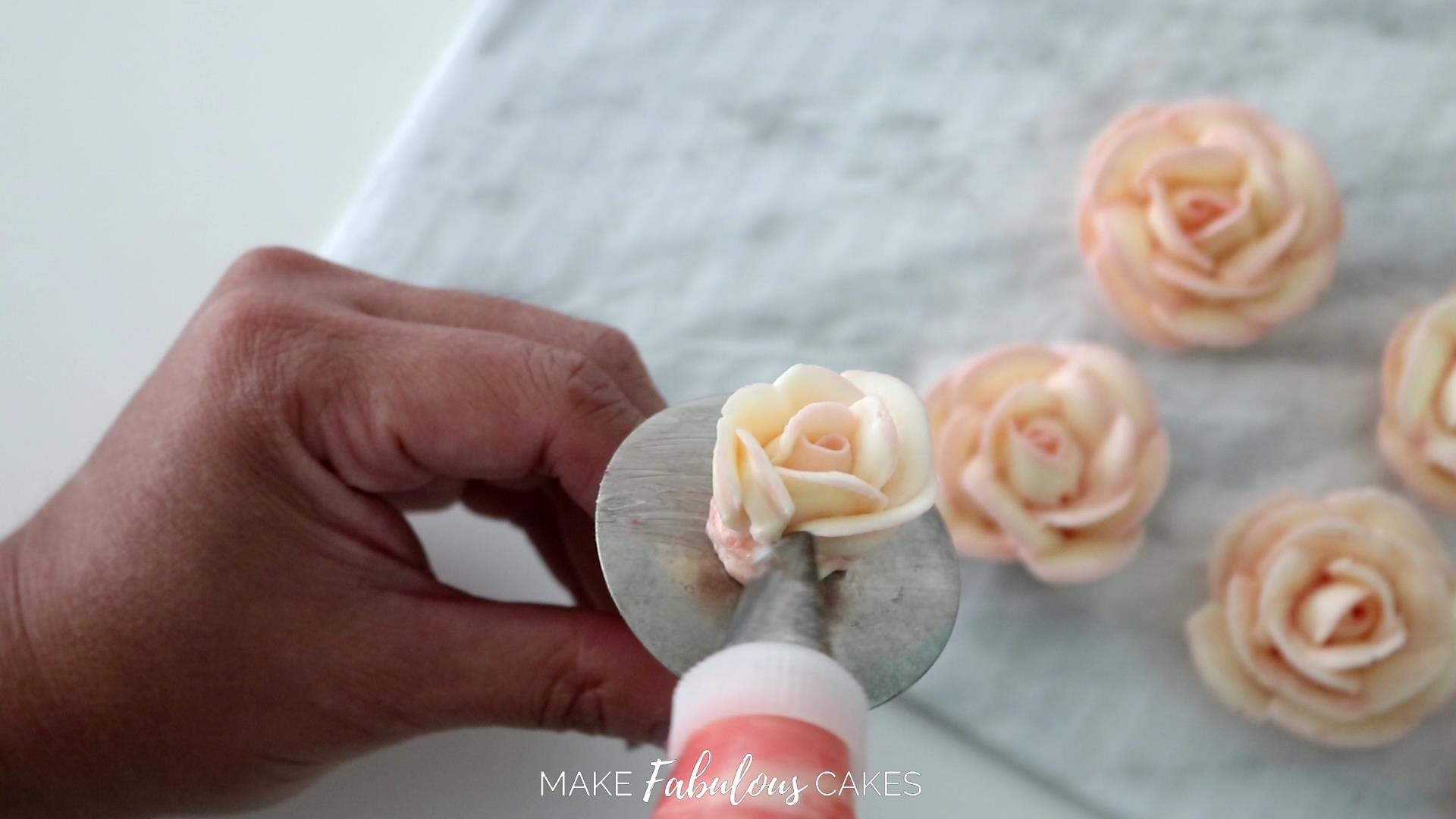 swan cake piping a buttercream rose