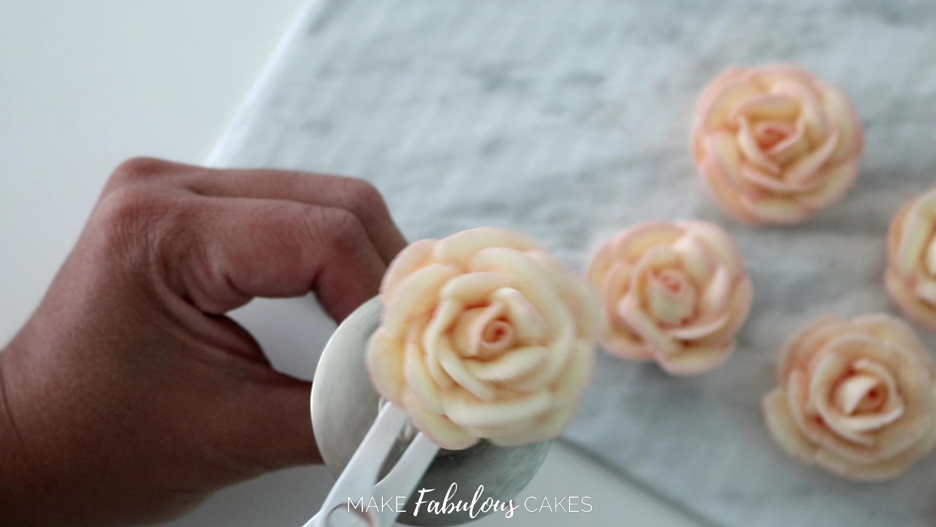 swan cake piping a buttercream rose