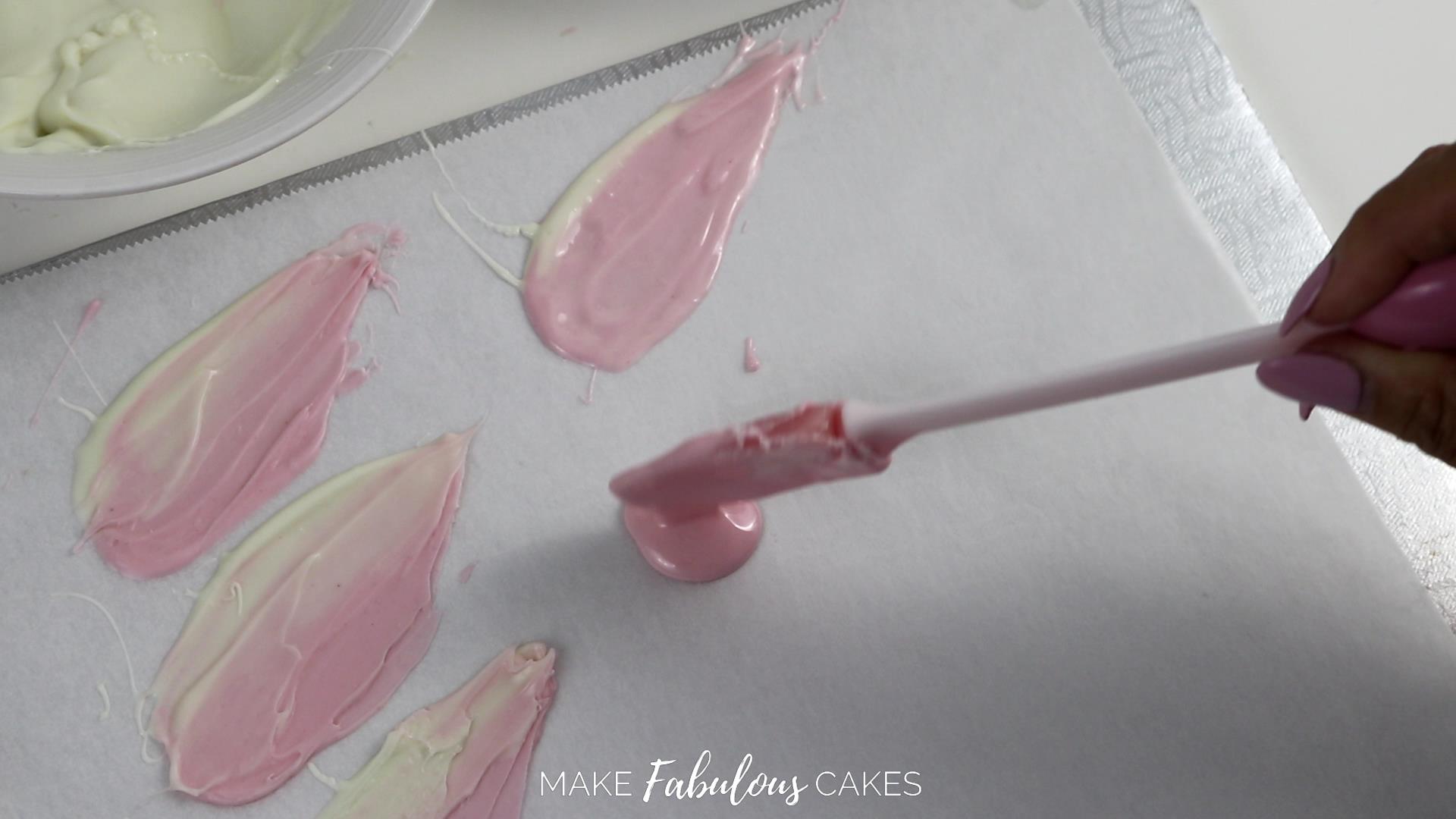 making swan cake feathers from chocolate