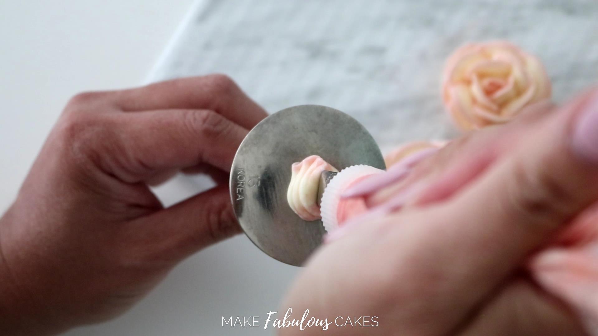 swan cake piping a buttercream rose