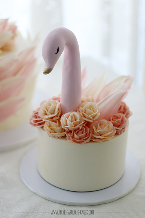 small swan cake with buttercream roses