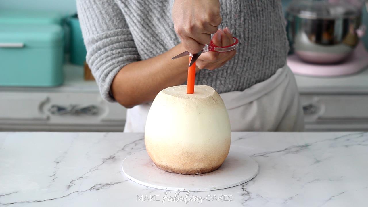 measuring and cutting boba tea straw as dowel for mushroom cake